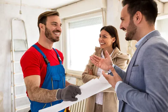 A Vantage Homes representative meeting with clients on site